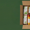 Bannerbild der veganen Box, gefüllt mit verschiedenen Vleisch- und Vurstwaren.