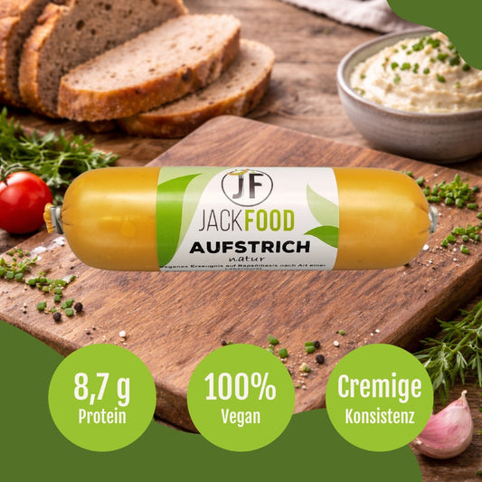 Der vegane Leberwurst Aufstrich von JackFood mit frischen Brot im Hintergrund.